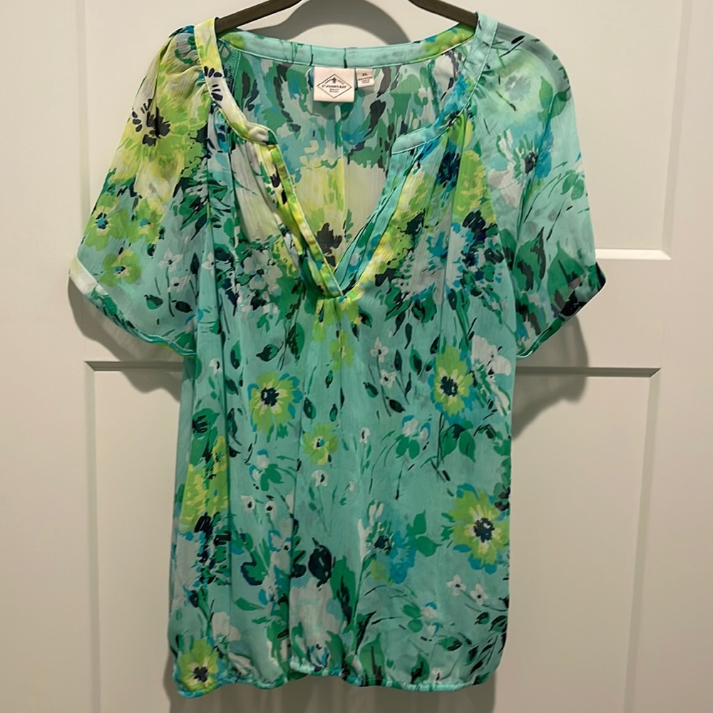 Brilliant colors in this sheer blouse.